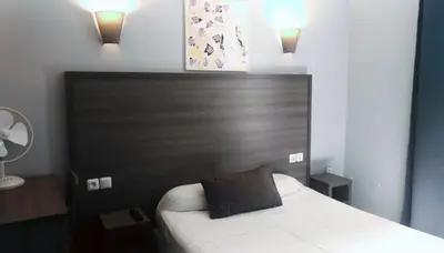 Un ou plusieurs lits dans un hébergement de l'établissement Hotel du Globe 18