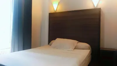 Un ou plusieurs lits dans un hébergement de l'établissement Hotel du Globe 18