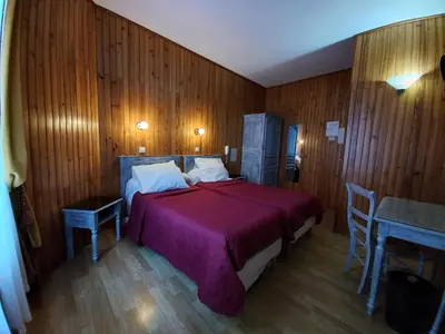 Un ou plusieurs lits dans un hébergement de l'établissement Hôtel Paris Nord