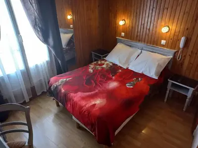 Un ou plusieurs lits dans un hébergement de l'établissement Hôtel Paris Nord