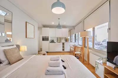 Un ou plusieurs lits dans un hébergement de l'établissement Studio Eiffel Tower by Studio prestige