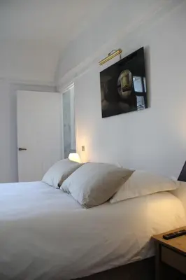 Un ou plusieurs lits dans un hébergement de l'établissement Appartement Champs Elysées
