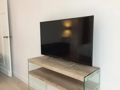 Télévision ou salle de divertissement dans l'établissement Appartement Champs Elysées