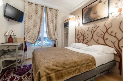 Un ou plusieurs lits dans un hébergement de l'établissement Hotel des Bains