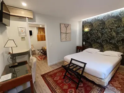 Un ou plusieurs lits dans un hébergement de l'établissement Hotel des Bains