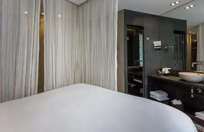 Un ou plusieurs lits dans un hébergement de l'établissement Hidden Hotel