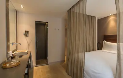 Un ou plusieurs lits dans un hébergement de l'établissement Hidden Hotel
