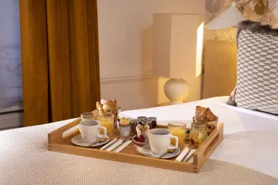 Un ou plusieurs lits dans un hébergement de l'établissement Hôtel Gramont