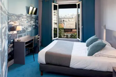 Un ou plusieurs lits dans un hébergement de l'établissement Hôtel Odessa Montparnasse