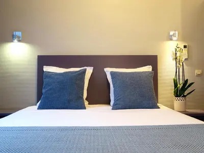 Un ou plusieurs lits dans un hébergement de l'établissement Hôtel Odessa Montparnasse