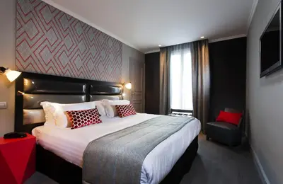 Un ou plusieurs lits dans un hébergement de l'établissement Hôtel Garance