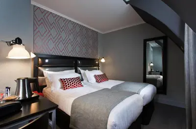 Un ou plusieurs lits dans un hébergement de l'établissement Hôtel Garance