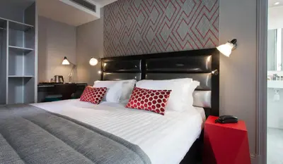 Un ou plusieurs lits dans un hébergement de l'établissement Hôtel Garance