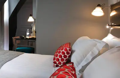Un ou plusieurs lits dans un hébergement de l'établissement Hôtel Garance
