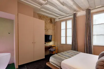 Un ou plusieurs lits dans un hébergement de l'établissement Hôtel de Notre-Dame