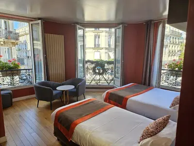 Un ou plusieurs lits dans un hébergement de l'établissement Home Latin
