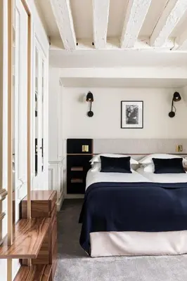 Un ou plusieurs lits dans un hébergement de l'établissement Hotel Verneuil Saint Germain