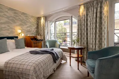 Un ou plusieurs lits dans un hébergement de l'établissement Hôtel Le Regent Paris