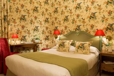 Un ou plusieurs lits dans un hébergement de l'établissement Hôtel Le Regent Paris