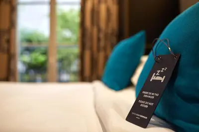 Un ou plusieurs lits dans un hébergement de l'établissement Hôtel Saint Germain