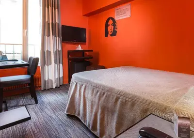 Un ou plusieurs lits dans un hébergement de l'établissement Hotel Concortel Paris