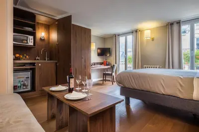 Un ou plusieurs lits dans un hébergement de l'établissement Hotel Concortel Paris