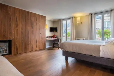 Un ou plusieurs lits dans un hébergement de l'établissement Hotel Concortel Paris