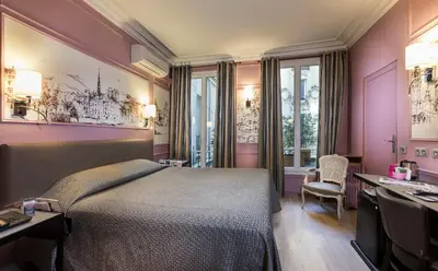 Un ou plusieurs lits dans un hébergement de l'établissement Hotel Concortel Paris