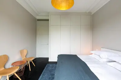 Un ou plusieurs lits dans un hébergement de l'établissement Habitat Parisien - Drouot Luxe