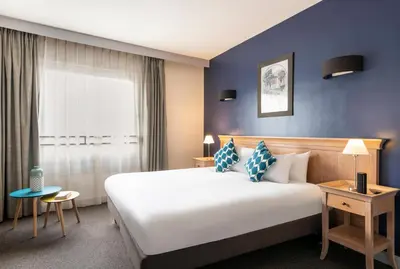 Un ou plusieurs lits dans un hébergement de l'établissement Aparthotel Adagio La Défense Esplanade