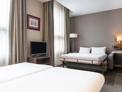 Un ou plusieurs lits dans un hébergement de l'établissement Aparthotel Adagio La Défense Esplanade