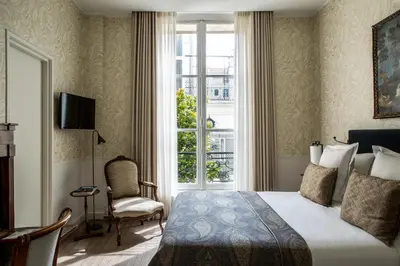 Un ou plusieurs lits dans un hébergement de l'établissement Hôtel des Saints Pères - Esprit de France