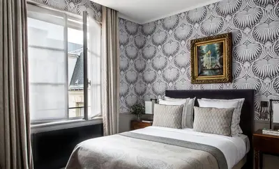 Un ou plusieurs lits dans un hébergement de l'établissement Hôtel des Saints Pères - Esprit de France