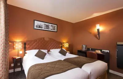 Un ou plusieurs lits dans un hébergement de l'établissement Hôtel du Prince Eugène