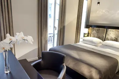 Un ou plusieurs lits dans un hébergement de l'établissement Hôtel Caron le Marais
