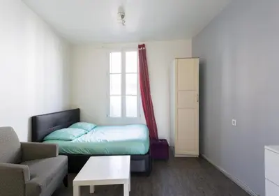 Un ou plusieurs lits dans un hébergement de l'établissement Studio Meublé