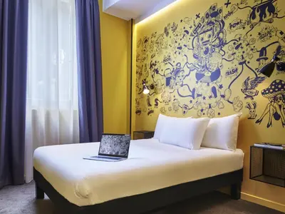 Un ou plusieurs lits dans un hébergement de l'établissement Ibis Styles Paris Gare de l'Est Magenta