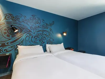 Un ou plusieurs lits dans un hébergement de l'établissement Ibis Styles Paris Gare de l'Est Magenta