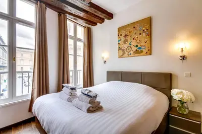 Un ou plusieurs lits dans un hébergement de l'établissement Upper Class Suites - Rue Saint Honoré