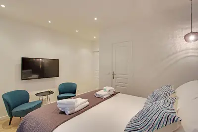 Un ou plusieurs lits dans un hébergement de l'établissement Pick A Flat's in Champs Elysees - Rue Percier