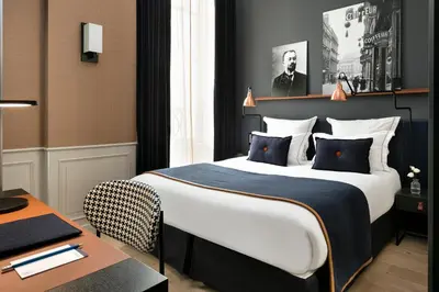 Un ou plusieurs lits dans un hébergement de l'établissement Hôtel Square Louvois