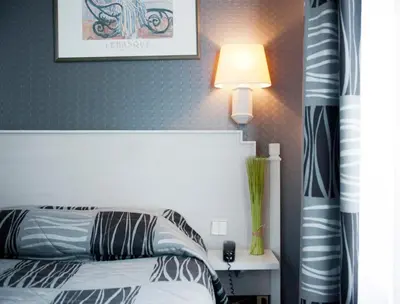 Un ou plusieurs lits dans un hébergement de l'établissement Hotel Miramar