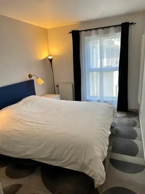 Un ou plusieurs lits dans un hébergement de l'établissement Appartement Lumineux Accor Arena Paris 13