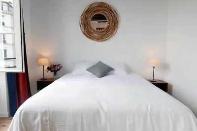 Un ou plusieurs lits dans un hébergement de l'établissement Apartments Cosy