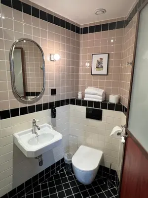 Salle de bains dans l'établissement Hôtel Marguerite