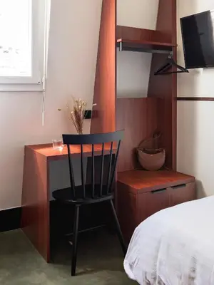 Un ou plusieurs lits dans un hébergement de l'établissement Hôtel Marguerite