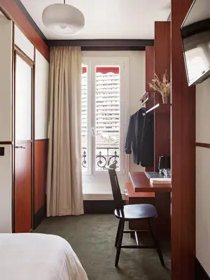 Un ou plusieurs lits dans un hébergement de l'établissement Hôtel Marguerite
