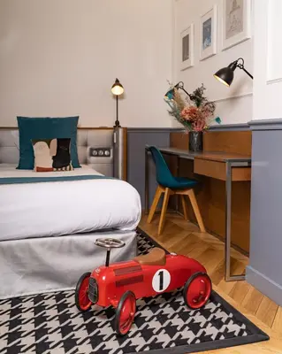 Un ou plusieurs lits dans un hébergement de l'établissement Hotel Petit Lafayette