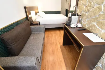 Coin salon dans l'établissement Hôtel Bonne Nouvelle