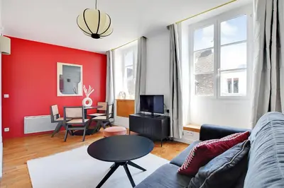 Télévision ou salle de divertissement dans l'établissement Residence central marais